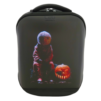 Black Ldb Ledback HD Smart LED Laptop Backpack with the LED screen showing a Halloween themed picture with a scary pumpkin, viewed from the front isolated on a transparent background.